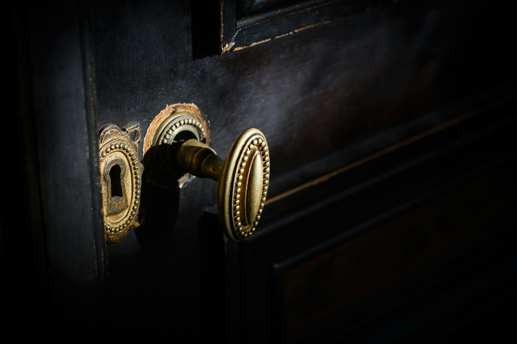 detail of antique golden door handle knob